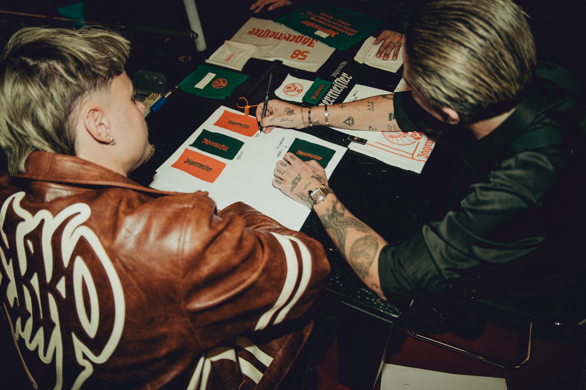 GEKKO designers reviewing Jägermeister fabric swatches in the studio