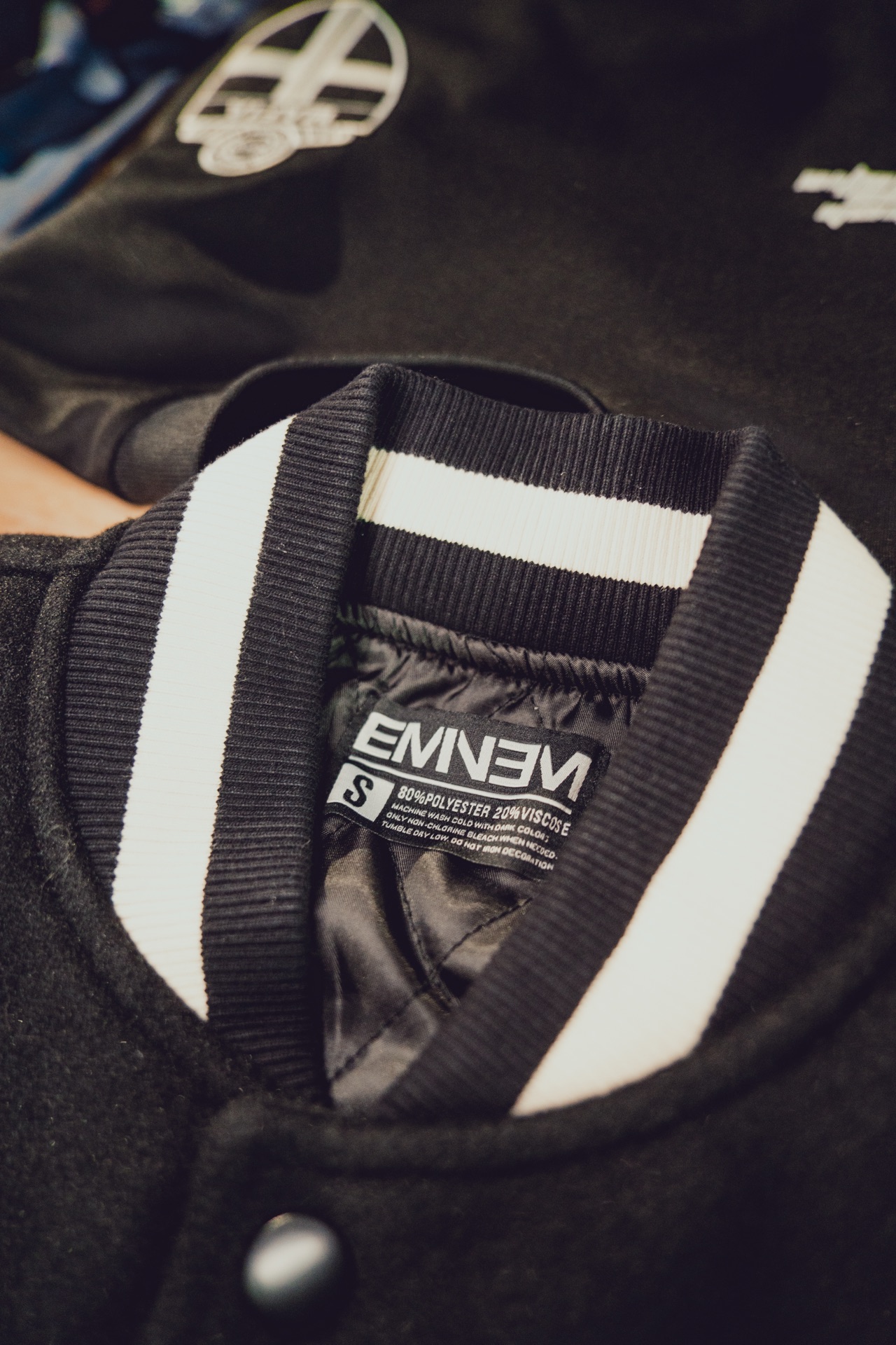 Eminem varsity jacket collar tag detail