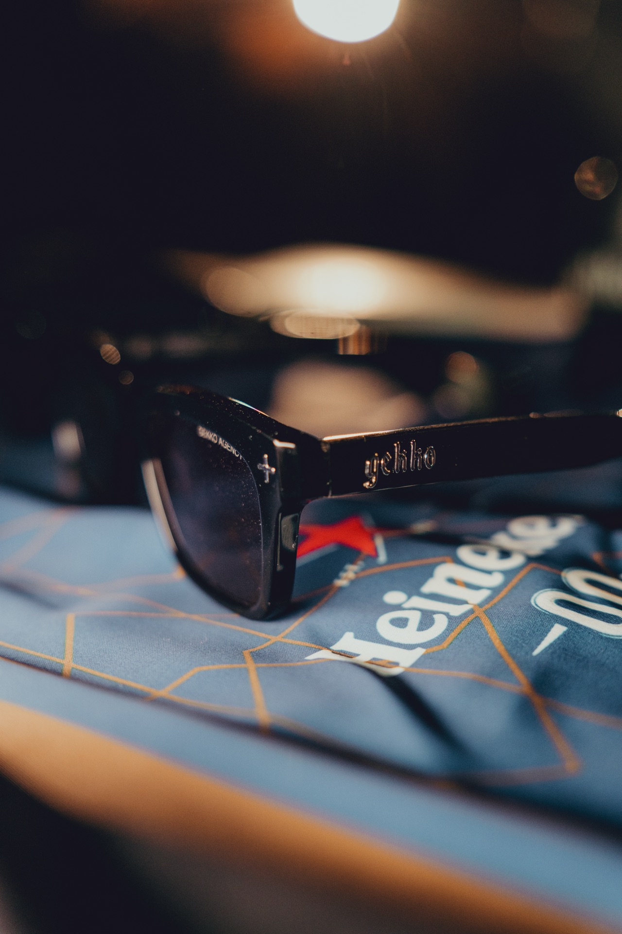 GEKKO branded sunglasses alongside Heineken merch