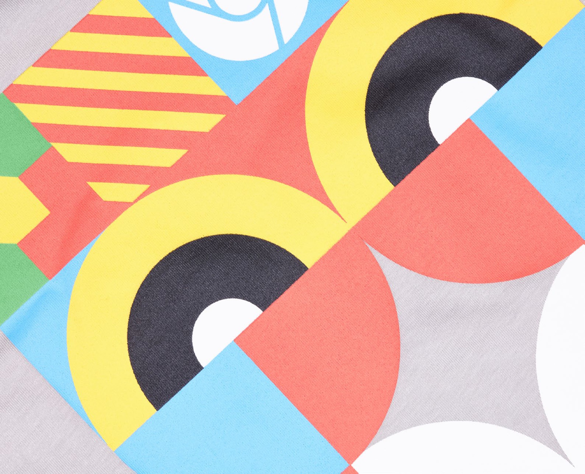Playful character print pattern across Chromebook field-team garment