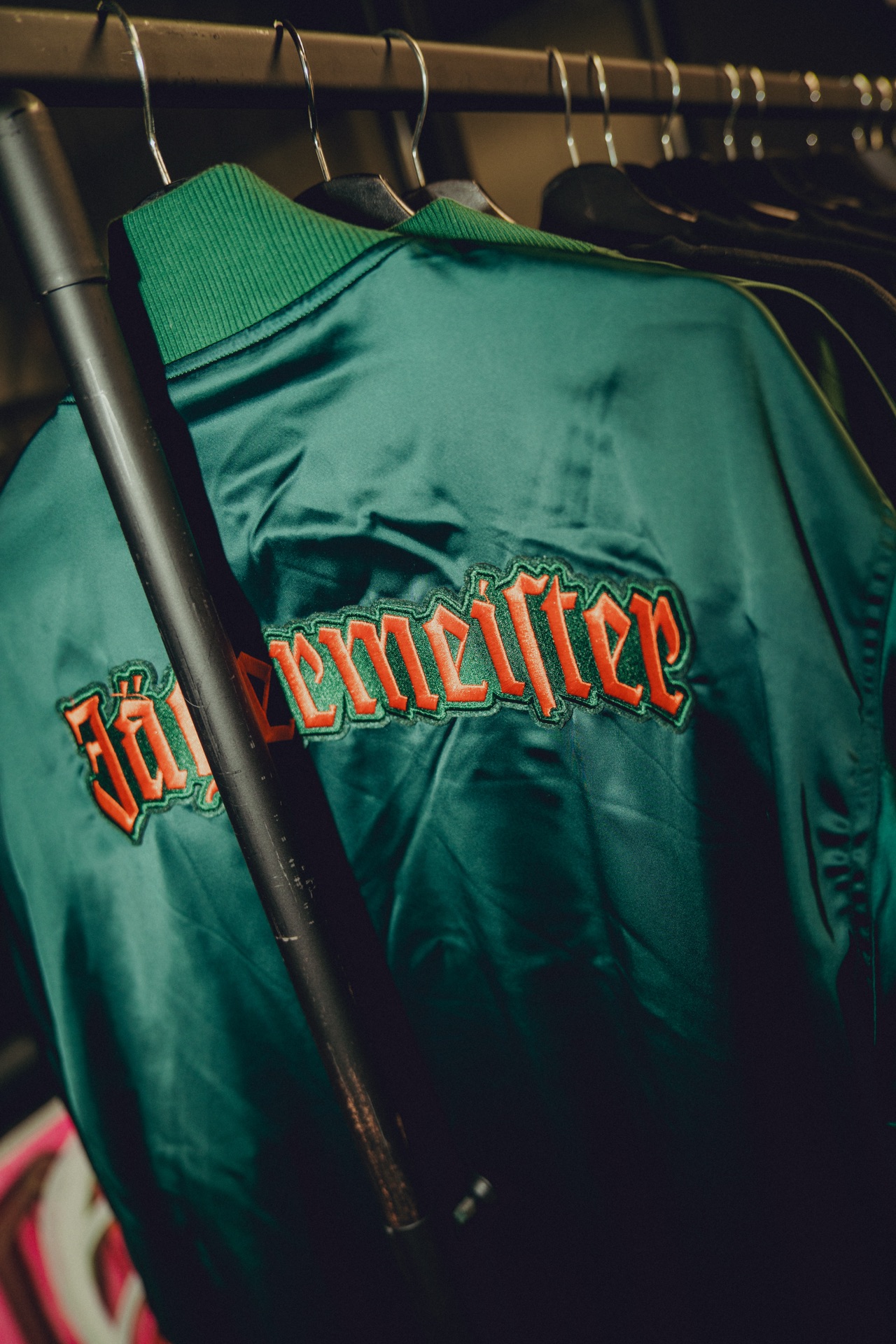 Jägermeister green satin bomber jacket — signature licensed piece