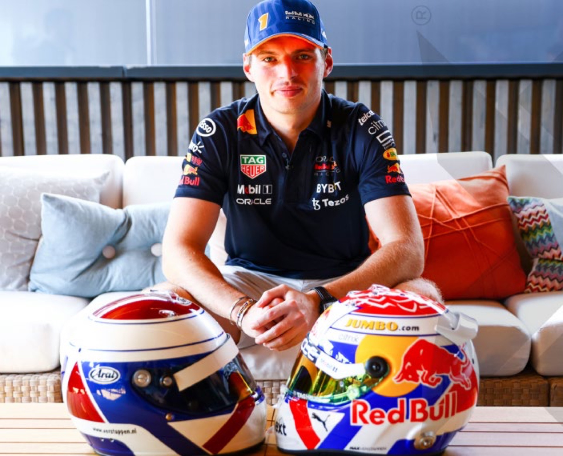 Max Verstappen with two race-weekend helmets